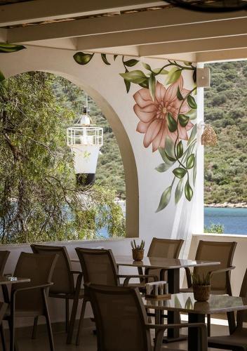 a restaurant with a flower mural on the wall at Kas Marin Hotel in Kas