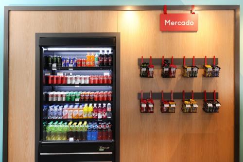 a soda machine in a store with drinks at avid hotel Guadalajara Aeropuerto Norte in Guadalajara