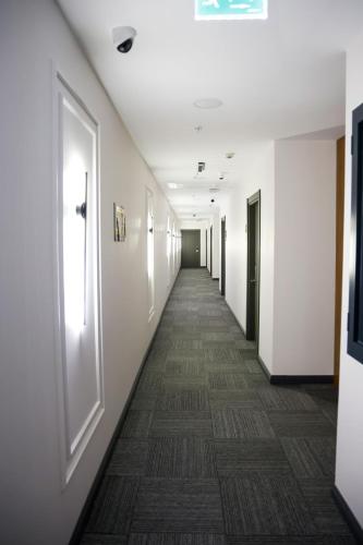 a hallway of an office building with a long corridor at Gezgin Hotel in Edirne