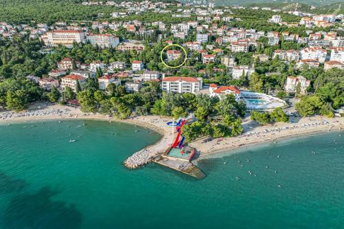 an aerial view of a beach with a roller coaster at Villa Erika Crikvenica in Crikvenica