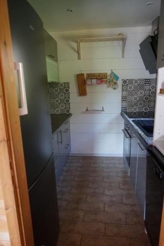 Kuchyň nebo kuchyňský kout v ubytování Chalet en bois avec très belle vue sur la montagne