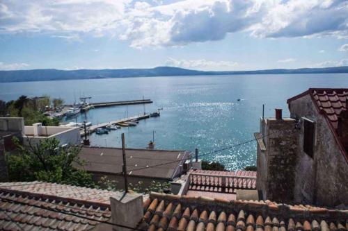 a view of a large body of water with a dock at Holiday home in Novi Vinodolski 15408 in Novi Vinodolski