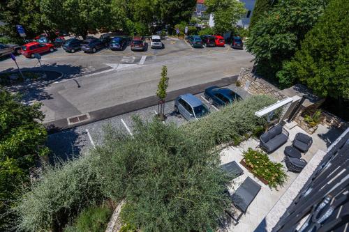 an aerial view of a parking lot with parked cars at Villa Erika Crikvenica in Crikvenica