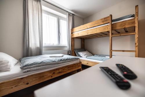 Postel nebo postele na pokoji v ubytování Apartmány Family Tree