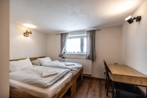 Postel nebo postele na pokoji v ubytování Apartmány Family Tree