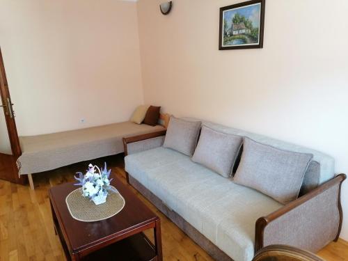 a living room with a couch and a table at LM 19 in Novi Sad
