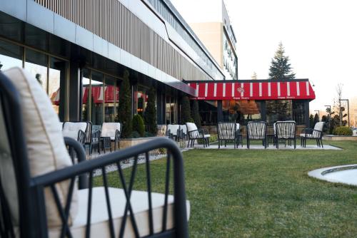 a group of chairs and tables outside of a building at Fier Life Center in Kayseri