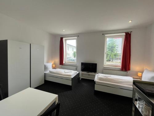 MonteurzimmerKING Leipzig-West 객실 침대