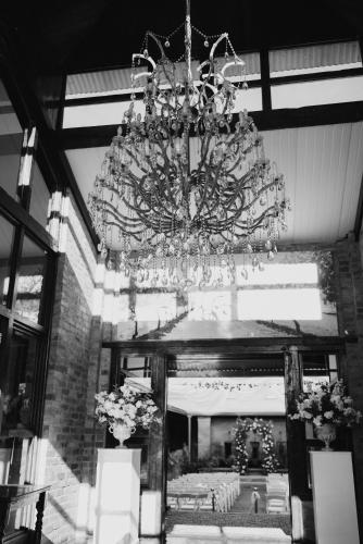 a large chandelier hanging from a ceiling in a building at Romantic Wine Estate Stay in The Midlands in Howick