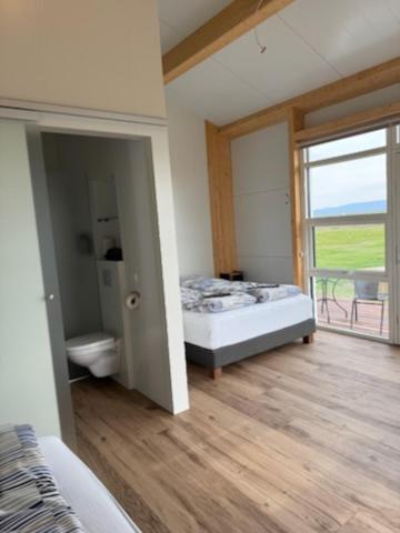 Postel nebo postele na pokoji v ubytování Grímstunga Guesthouse Hólsfjöll