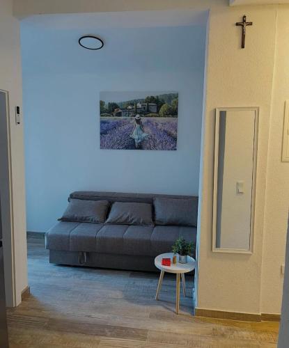 a living room with a couch and a table at Apartments Ravlic in Neum