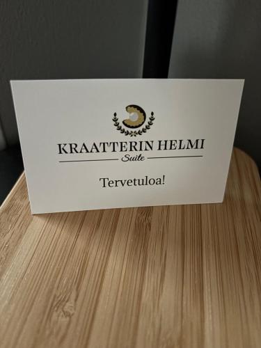 a box sitting on top of a wooden table at Kraatterin Helmi Suite in Lappajärvi