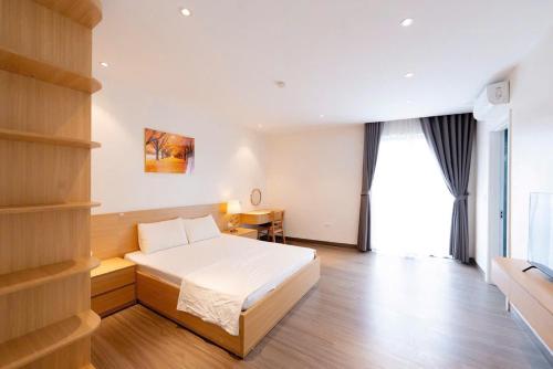 Ένα ή περισσότερα κρεβάτια σε δωμάτιο στο Bai Chay Apartment