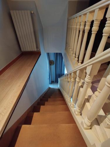 a staircase in a house with wooden floors at Hotel Continental in Turin
