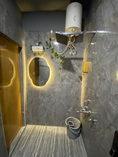 a bathroom with a sink and a toilet in a room at Heritage homestay in Puducherry