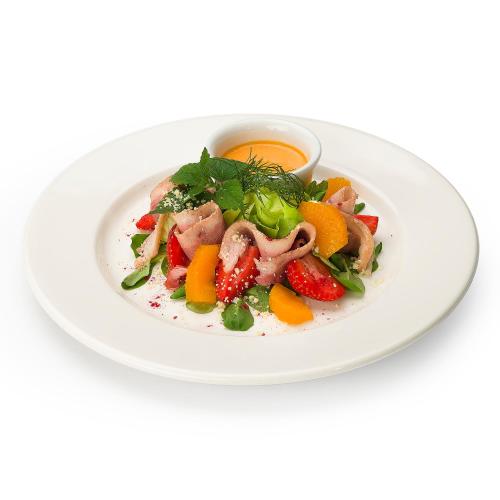 a white plate of food with fruit and vegetables at Zamek w Krasiczynie in Krasiczyn