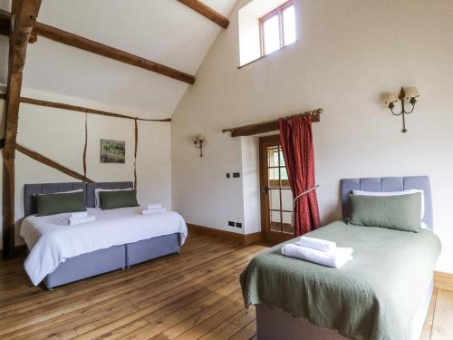 Ένα ή περισσότερα κρεβάτια σε δωμάτιο στο Stud Farm House