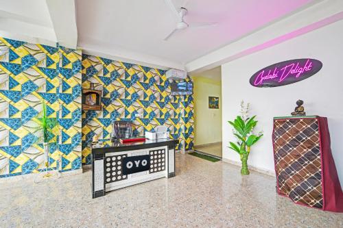 a room with colorful tiles on the walls at Hotel O Gulabi Delight in Faridabad