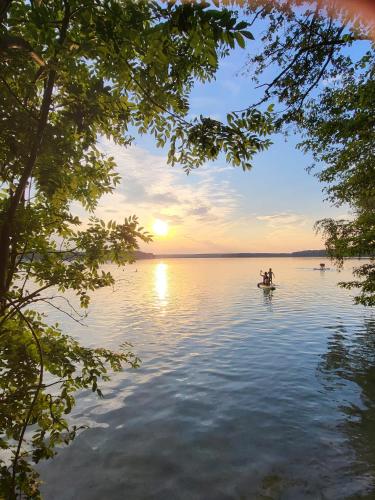 two people in a boat on a lake at sunset at Lubuskie jezioro in Wilkowo