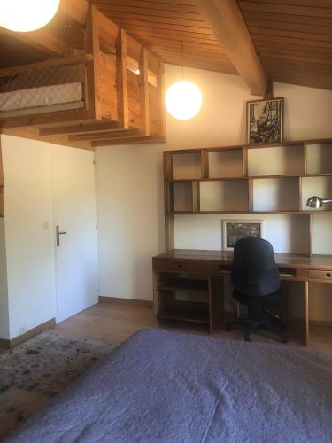 a bedroom with a desk and a chair at Villa dans Site Exceptionnel in Mourèze