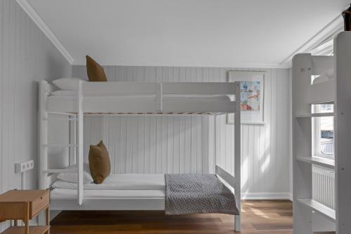 a bunk bed in a room with a staircase at Berg Apartments in Reykjavík