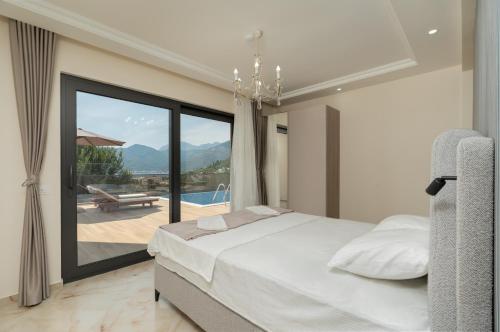 a bedroom with a bed and a view of a pool at Villa Boka in Tivat