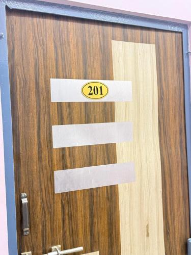 a door with the number on it at The Prince Hotel in Kharagpur