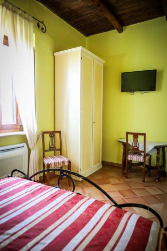 Ένα ή περισσότερα κρεβάτια σε δωμάτιο στο Hotel Casale 900