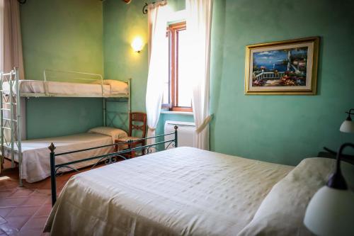 Ένα ή περισσότερα κρεβάτια σε δωμάτιο στο Hotel Casale 900