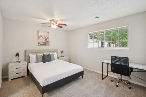 a bedroom with a bed and a desk and a window at Kenridge Apartments 1635 I Comfy 2 Bed 2 Bath in Decatur