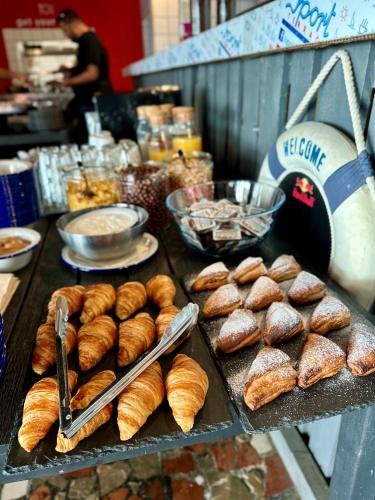 a bunch of pastries on a table in a bakery at Oliver Lux in Tihany