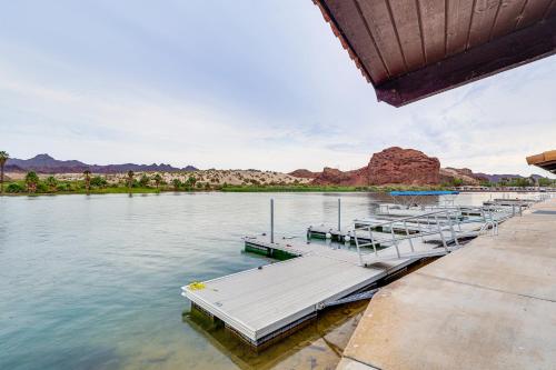 a group of boats docked at a dock on the water at Spacious Parker Home with On-Site River Access! in Parker