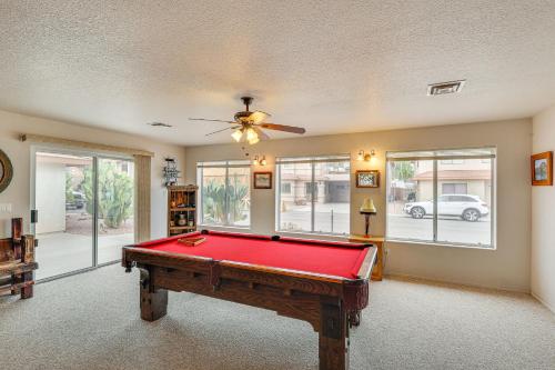 a pool table in a living room with a ceiling fan at Spacious Parker Home with On-Site River Access! in Parker