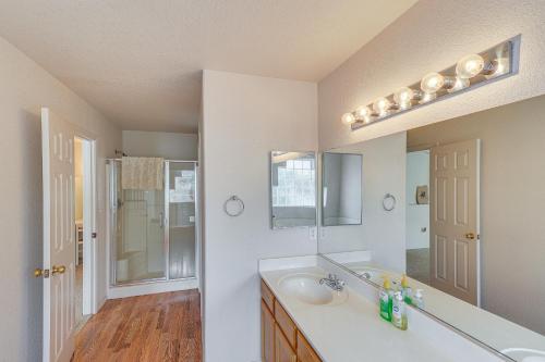 a bathroom with a sink and a mirror at Spacious Parker Home with On-Site River Access! in Parker
