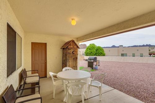 a patio with a table and chairs on a balcony at Spacious Parker Home with On-Site River Access! in Parker