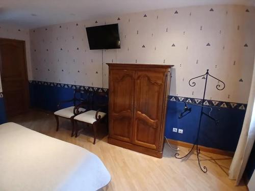 Ένα ή περισσότερα κρεβάτια σε δωμάτιο στο Chambres d'hôtes La Cabriole - Entre Amboise & Chenonceau