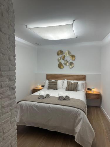 Postel nebo postele na pokoji v ubytování Casa Rural con piscina privada en casco urbano de Náquera Botigueta 25