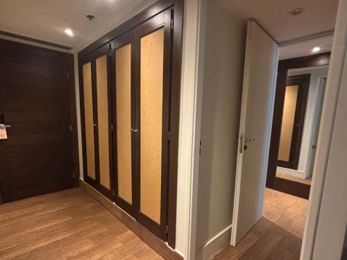 a hallway with sliding glass doors in a room at Loi Suites Iguazu Hotel in Puerto Iguazú