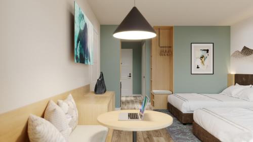 Ein Bett oder Betten in einem Zimmer der Unterkunft Sun & Ski Inn and Suites