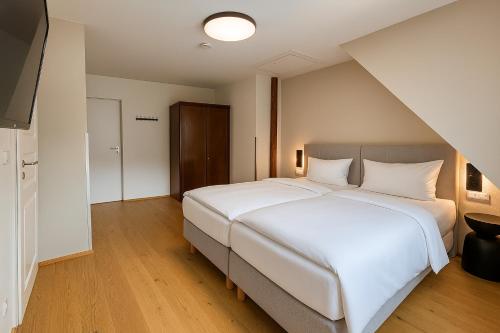 Ένα ή περισσότερα κρεβάτια σε δωμάτιο στο MYA Weinland Hotel Kobern-Gondorf