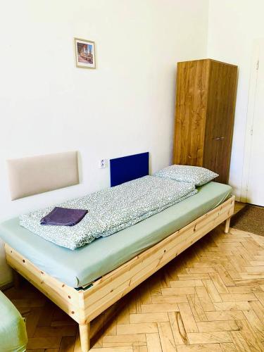 a bedroom with a wooden bed in a room at Hostel Moravia Ostrava in Ostrava