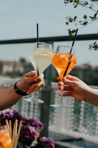 a group of people holding drinks in their hands at Radisson Blu Hotel Lietuva in Vilnius