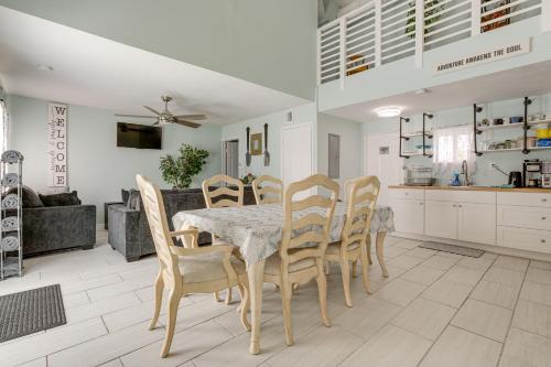 a kitchen and dining room with a table and chairs at 5 Mi to Boat Cruises! WPB Retreat with Pool Access in West Palm Beach