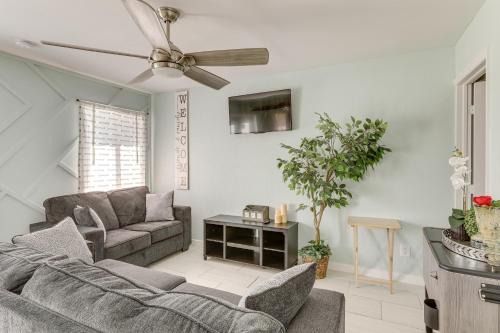 a living room with a couch and a ceiling fan at 5 Mi to Boat Cruises! WPB Retreat with Pool Access in West Palm Beach