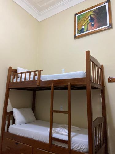 two bunk beds in a room with a picture on the wall at Hostel Manaus in Manaus