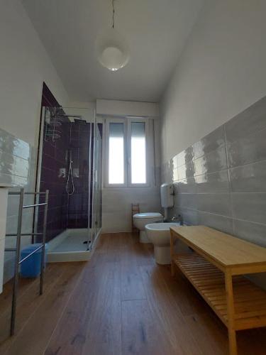 a bathroom with a toilet and a shower and a sink at L'acero in La Spezia