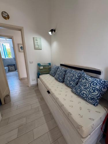 En eller flere senge i et værelse på Marilù Casa Vacanza