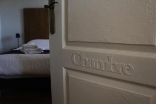 a door with the word chambride written on it at Maison centaure in Maisonnais