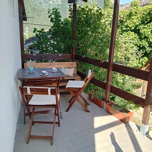 a table and chairs sitting on a patio at Scola veja in Chianocco