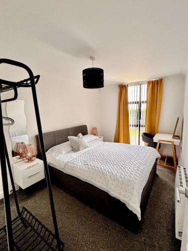 a bedroom with a bed in a room at Pochin House Collections in St Austell